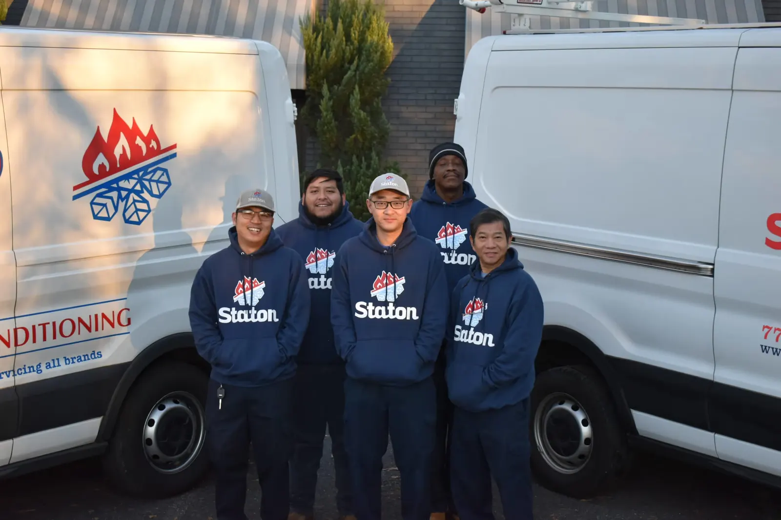 The Staton team outside the shop