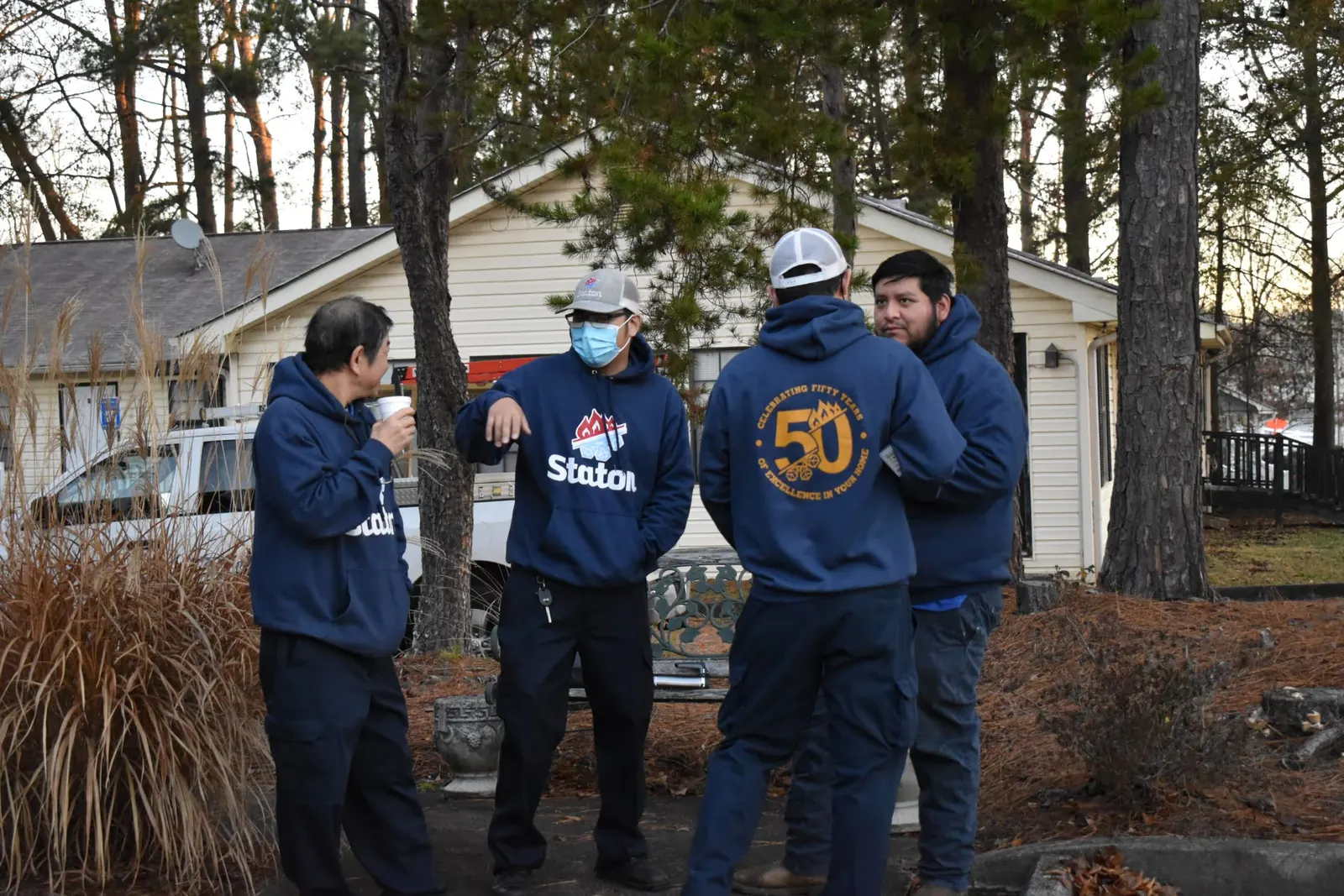 Staton crew in 50th-anniversary hoodies